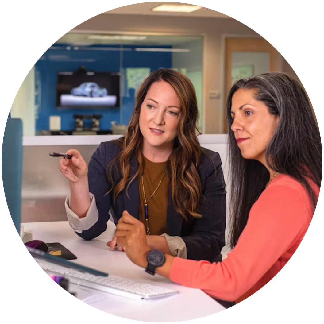 Two women working on a computer