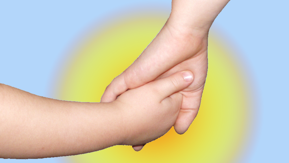 adult women hand hollowing a childs hand